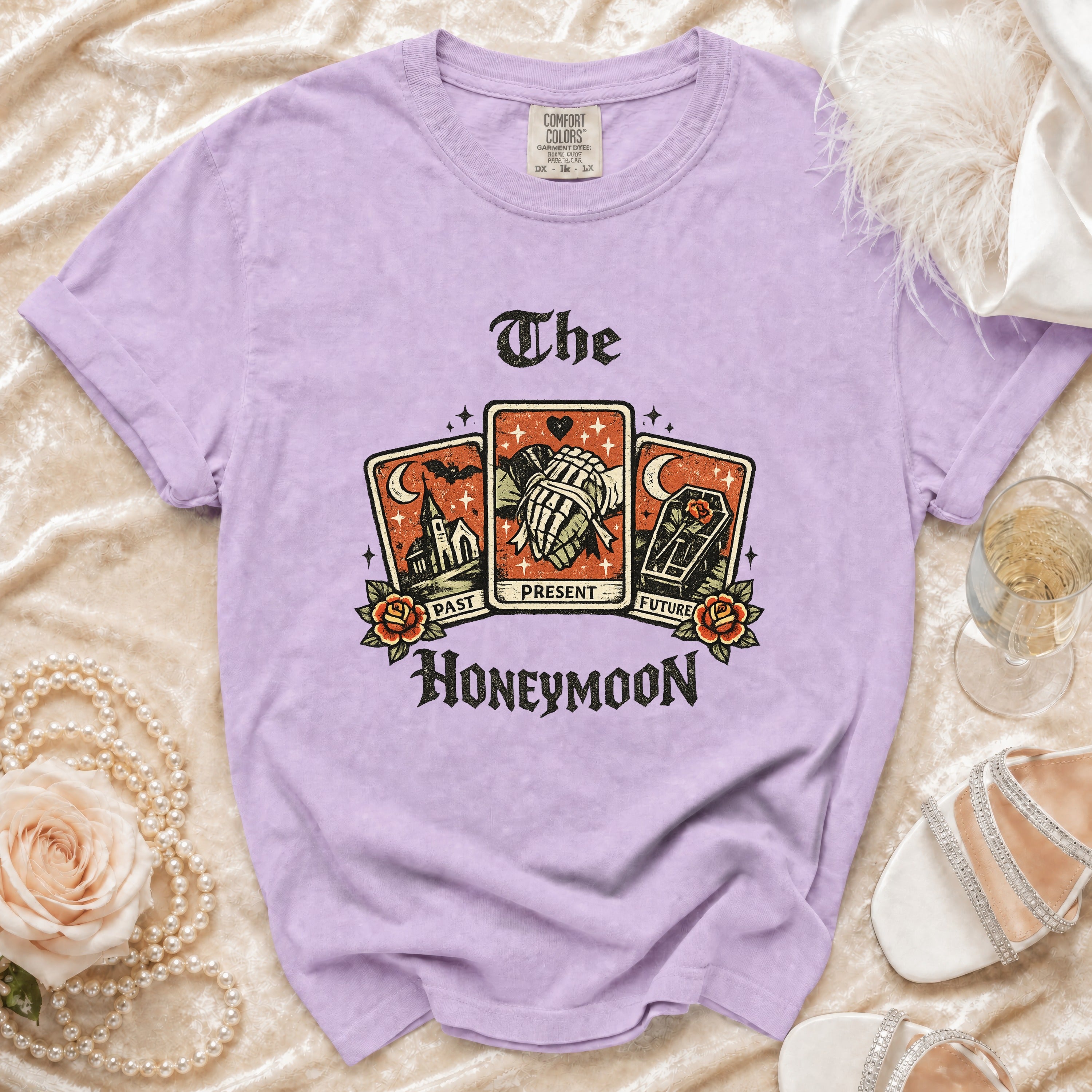 Lilac t-shirt with Tarot cards and "The Honeymoon" text graphic.