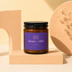 Harper + Miles TOI ET MOI candle in amber jar with black lid.