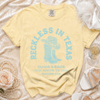 Pale yellow t-shirt with "Reckless in Texas" and bachelorette details.