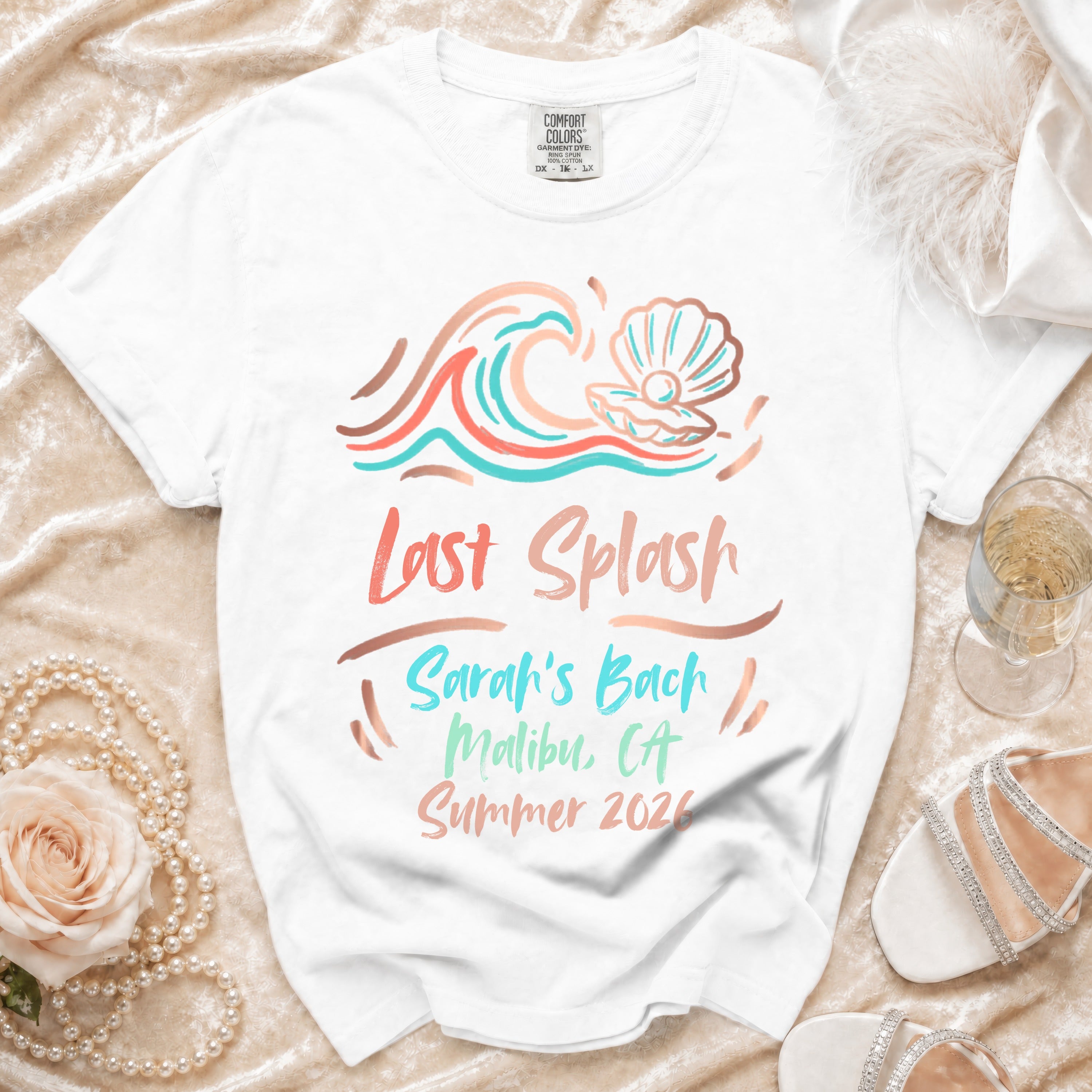 White t-shirt with "Last Splash Sarah's Bach Malibu, CA Summer 2026" graphic.