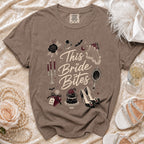 Brown t-shirt with "This Bride Bites" graphic, ring, bat, and cake.