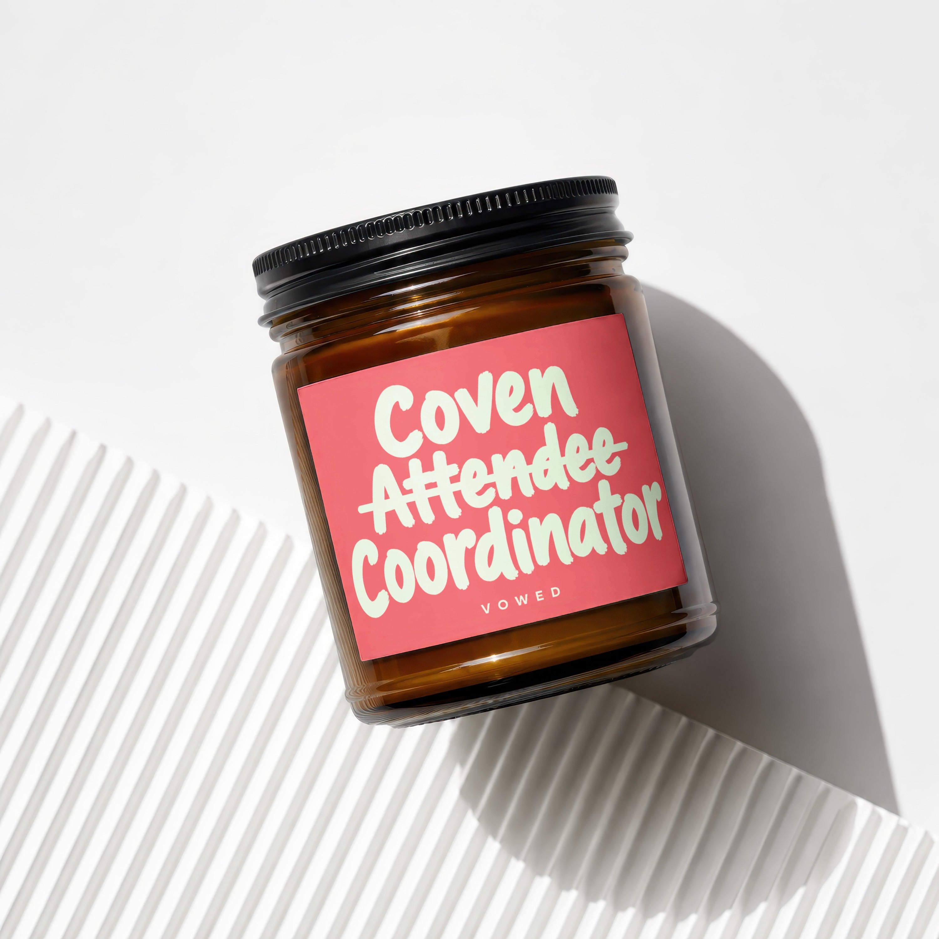 Amber jar candle titled "Coven Attendee Coordinator" by Vowed.