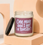 Glass candle with burgundy label that reads "One more and I get a toaster VOWED".