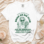 White t-shirt with green text and graphics of a skeleton bride, "Bride or Die Club".