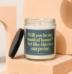 Candle with text "Will you be my maid of honor? Act like this is a surprise. VOWED"