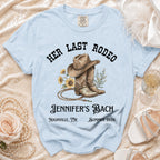 Light blue t-shirt with "Her Last Rodeo Jennifer's Bach" graphic.