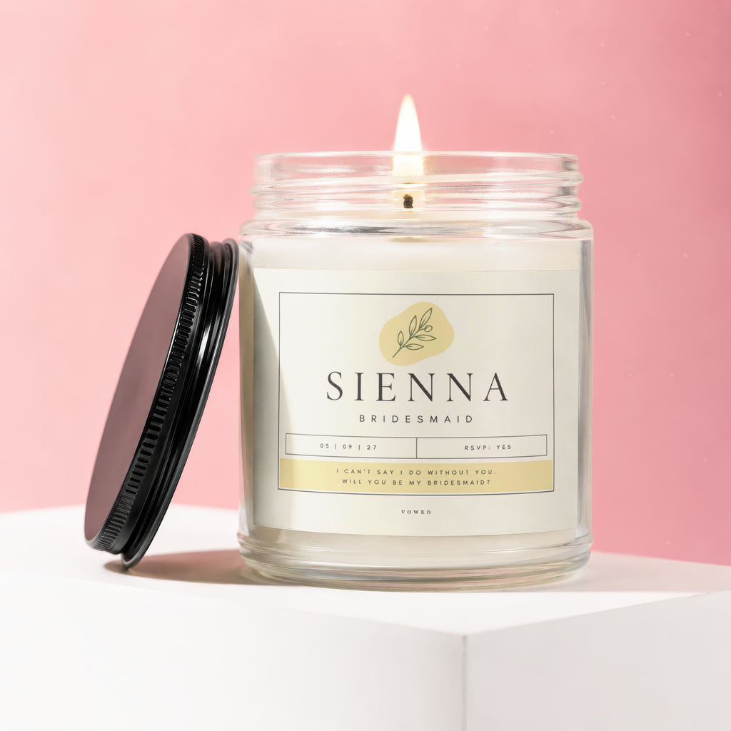 Lit candle in a glass jar labeled "Sienna Bridesmaid" with a question.