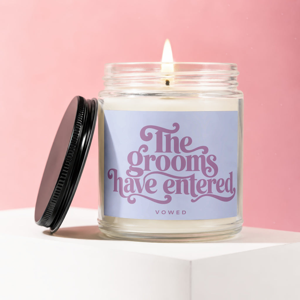 Candle with "The grooms have entered" text and "VOWED" on a lavender label.