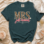 Teal t-shirt with "MRS just married" in leopard print and script, featuring a ring graphic.
