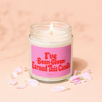 Glass jar candle with pink label reading "I've Earned This Candle"