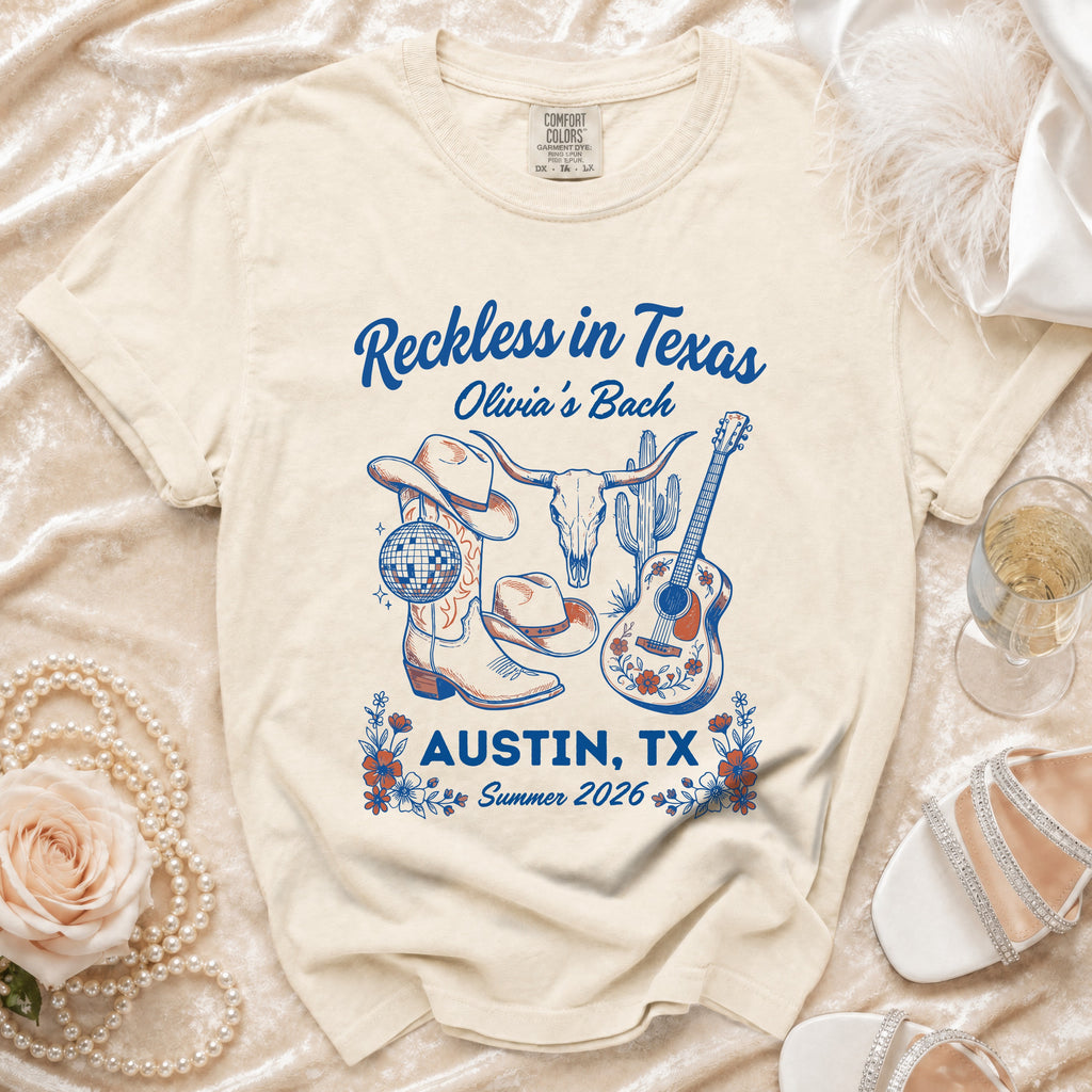 T-shirt with "Reckless in Texas Olivia's Bach Austin, TX Summer 2026" and Western graphics.