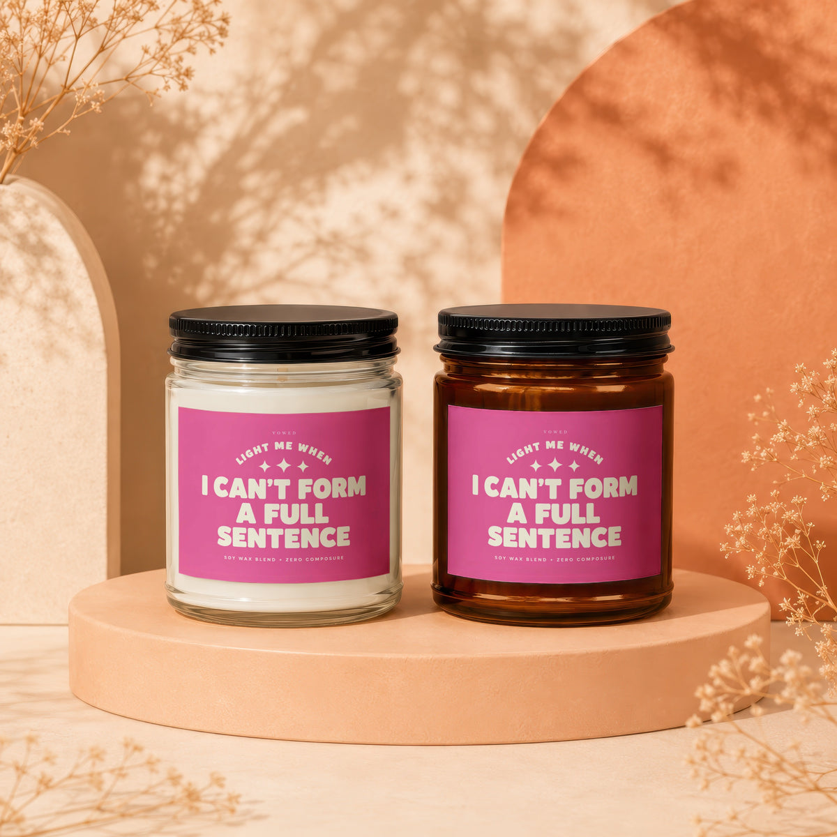 Two candles with pink labels stating "I can't form a full sentence."