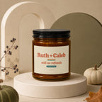 Amber candle jar labeled "Ruth + Caleb still no refunds since 2009" on a pedestal.