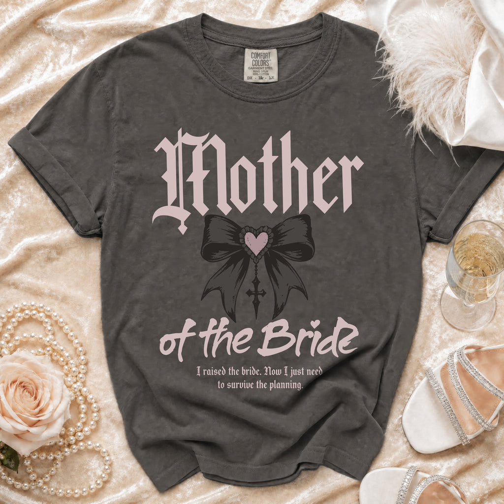 "Mother of the Bride" shirt with gothic font, bow graphic, and quote.