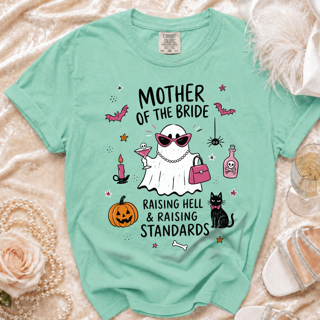 Mint green t-shirt with "Mother of the Bride" graphic featuring a ghost and festive elements.