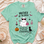 Mint green t-shirt with "Mother of the Bride" graphic featuring a ghost and festive elements.