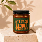 Amber candle with black lid, label reads "Smells Like Sh*t Faced At Your Wedding".