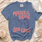 Blue t-shirt with "Mother of the Bride Boo Crew" text and ghost/cat graphics.