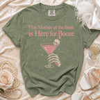 Olive green t-shirt with "This Mother of the Bride is Here for Booze" text and graphic.