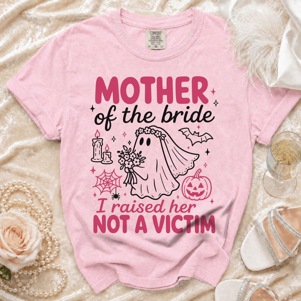 Pink t-shirt with "Mother of the Bride I raised her NOT A VICTIM" text.