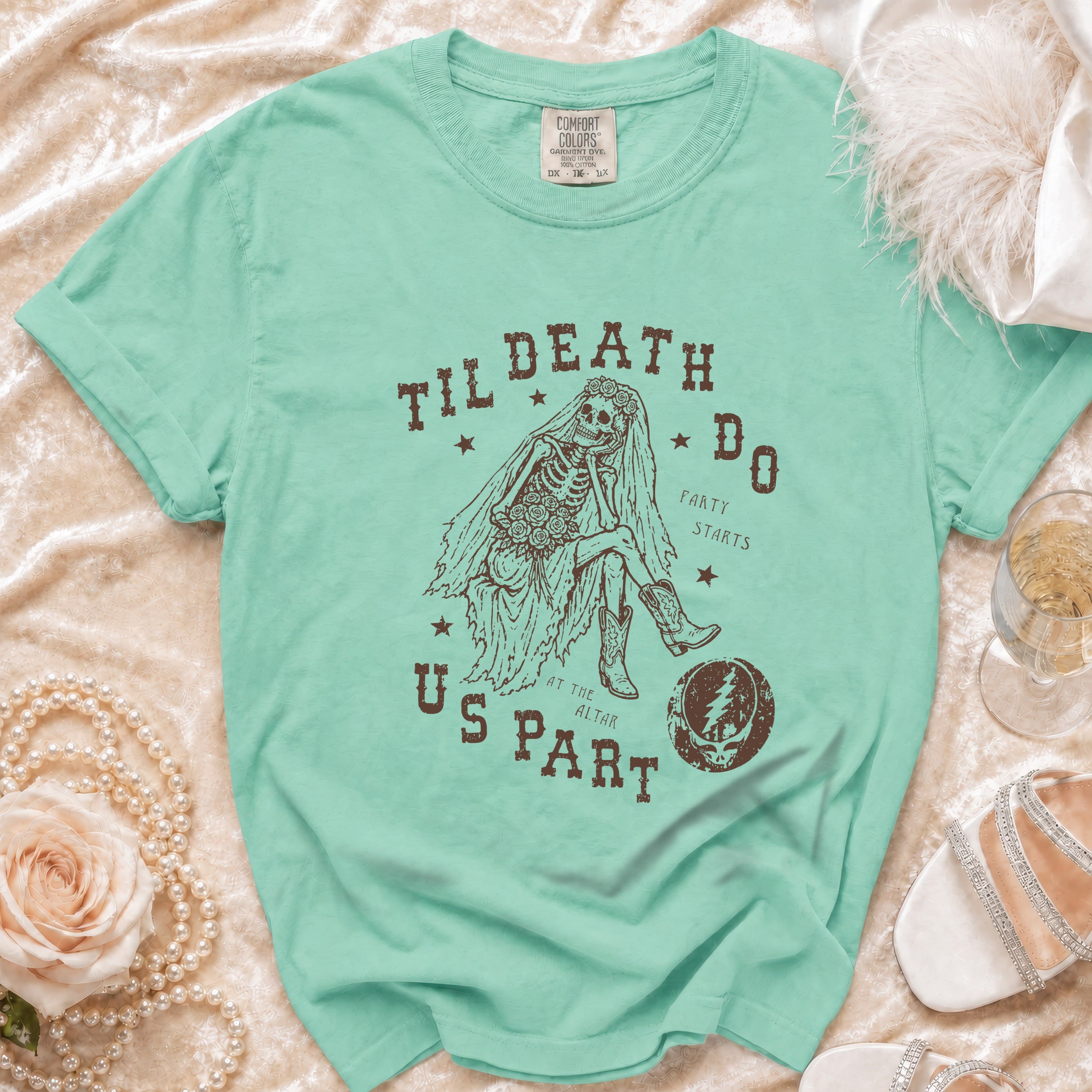 Teal t-shirt with skeleton bride graphic and text "Til Death Do Us Part".