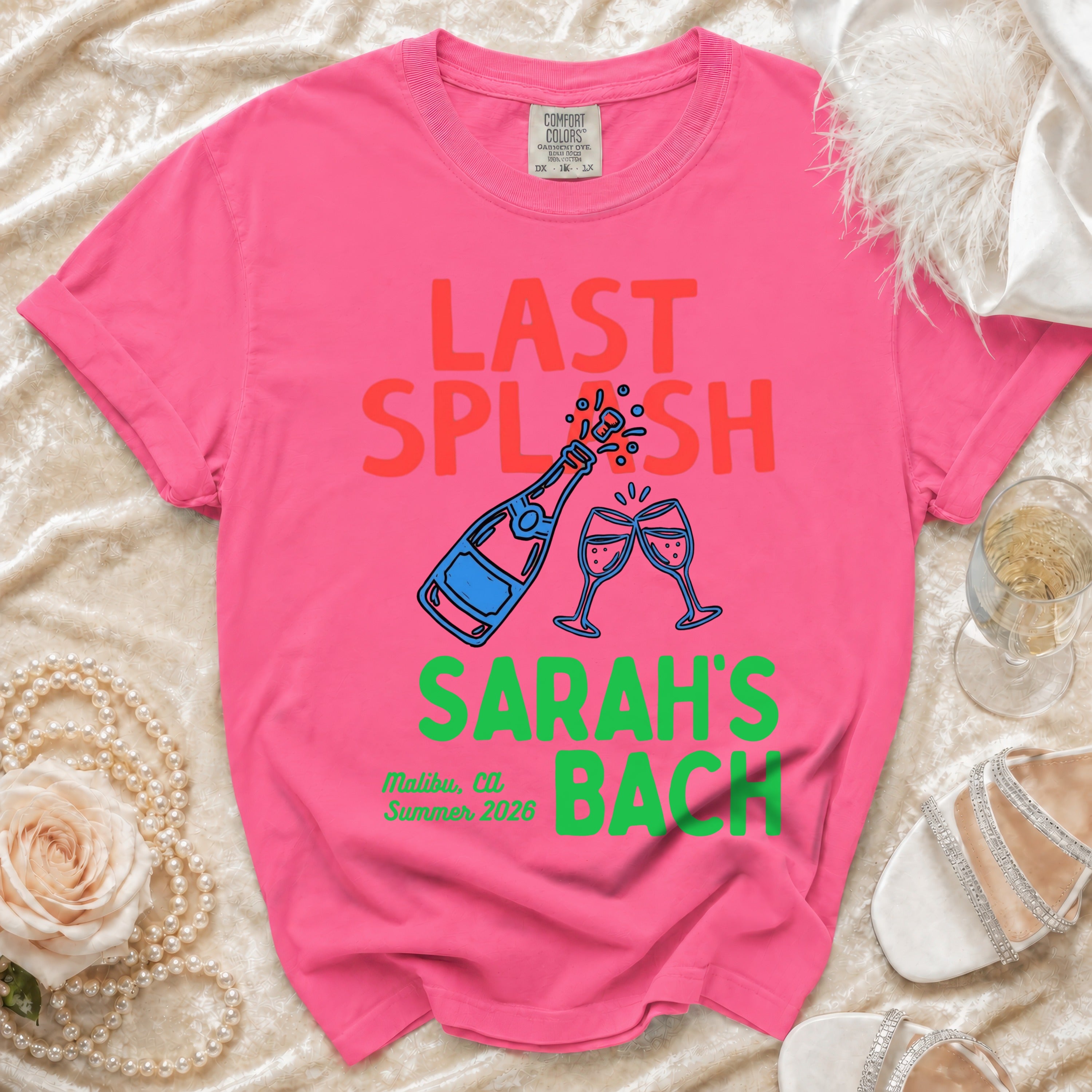Pink t-shirt with "LAST SPLASH SARAH'S BACK" and Malibu, CA, Summer 2026.