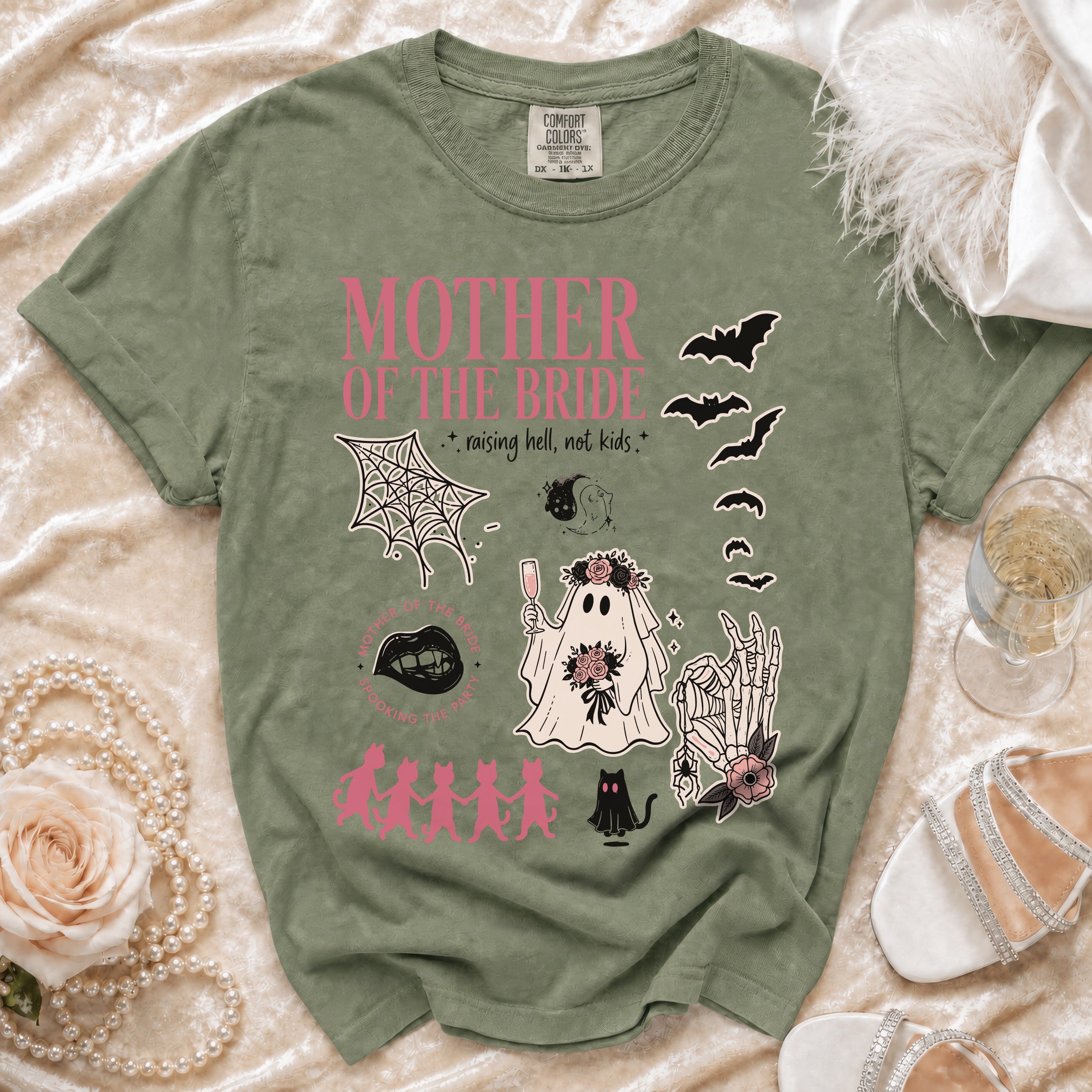 Green t-shirt with "Mother of the Bride" and spooky Halloween graphics.