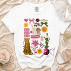 White t-shirt with "Mother of the Bride" graphics, including a ghost, leopard, and lily.