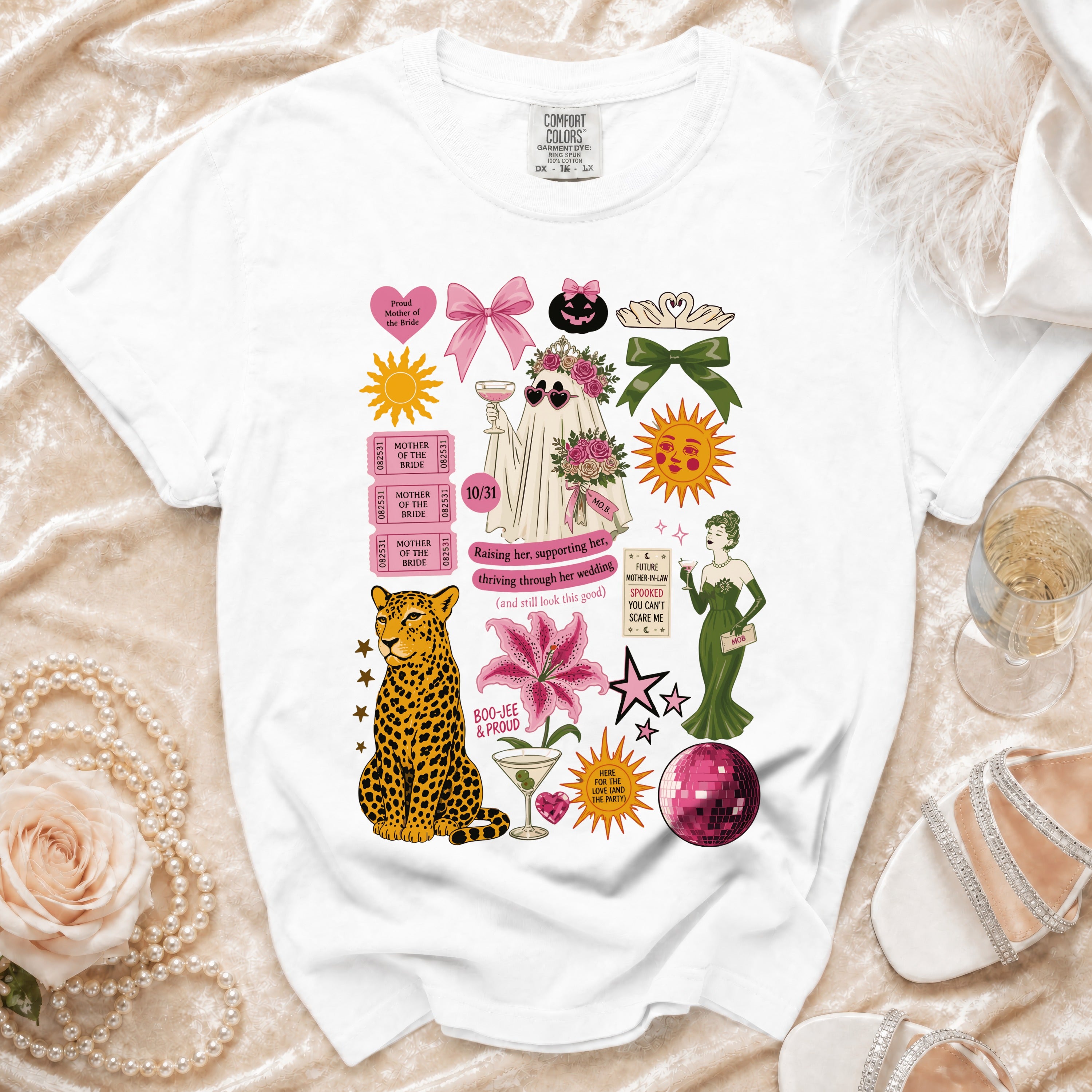 White t-shirt with "Mother of the Bride" graphics, including a ghost, leopard, and lily.