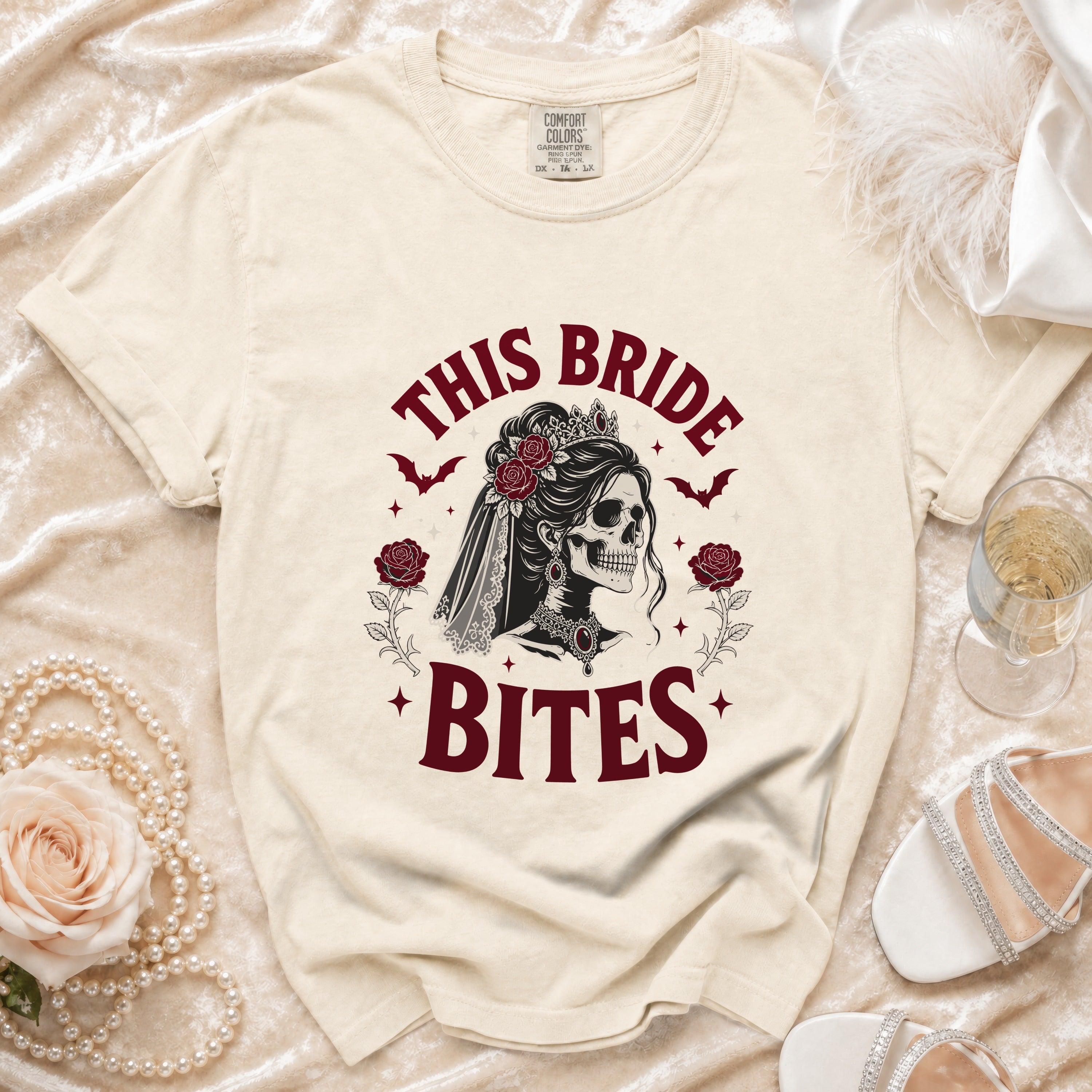 Cream t-shirt with "This Bride Bites" gothic skeleton bride graphic.