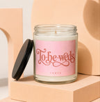 Glass candle with "To-be-weds" and "vowed" text on a pink label.