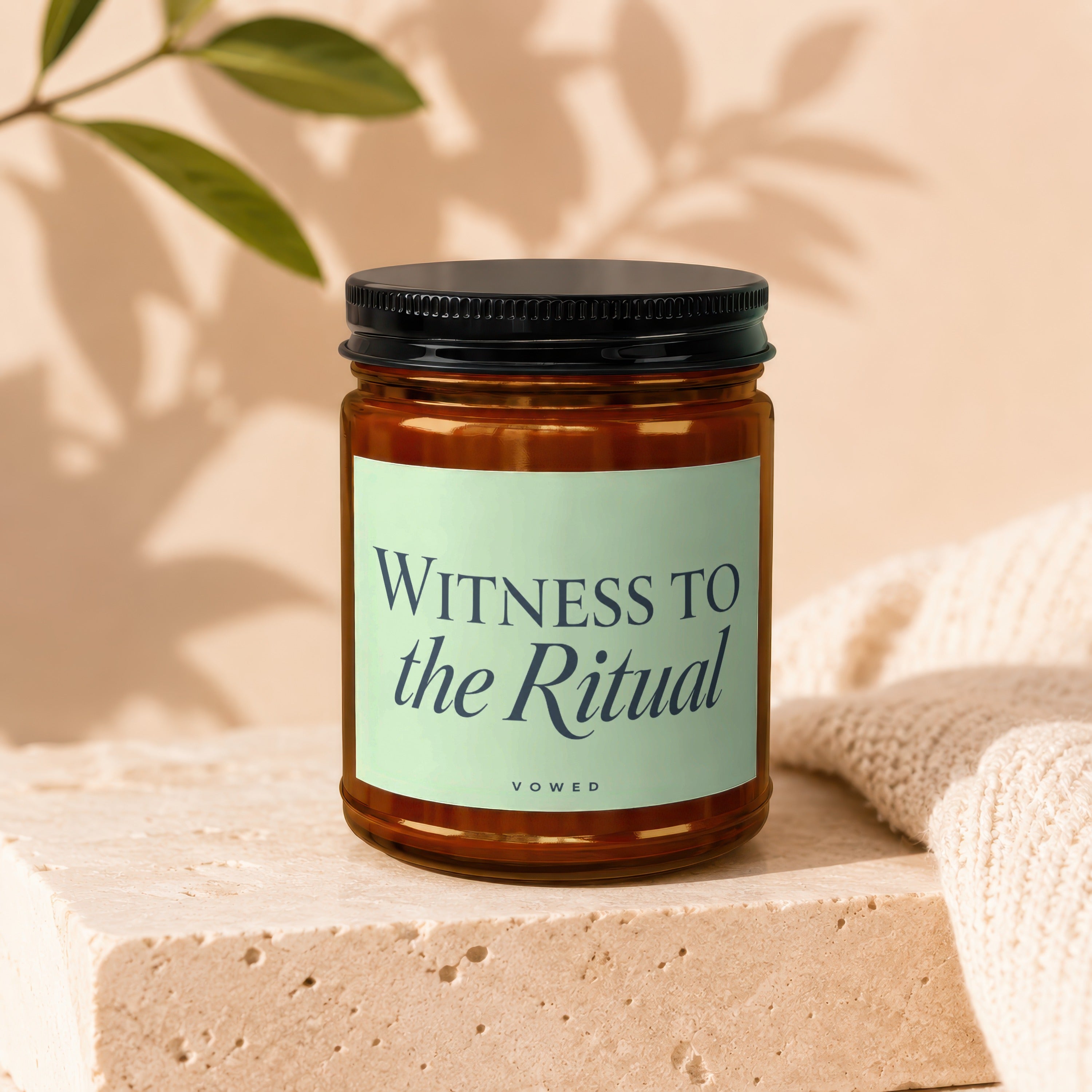 Amber glass candle labeled "WITNESS TO the Ritual VOWED."