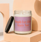 Candle with pink label reading "Happily Ever After Starts Now" with text below.