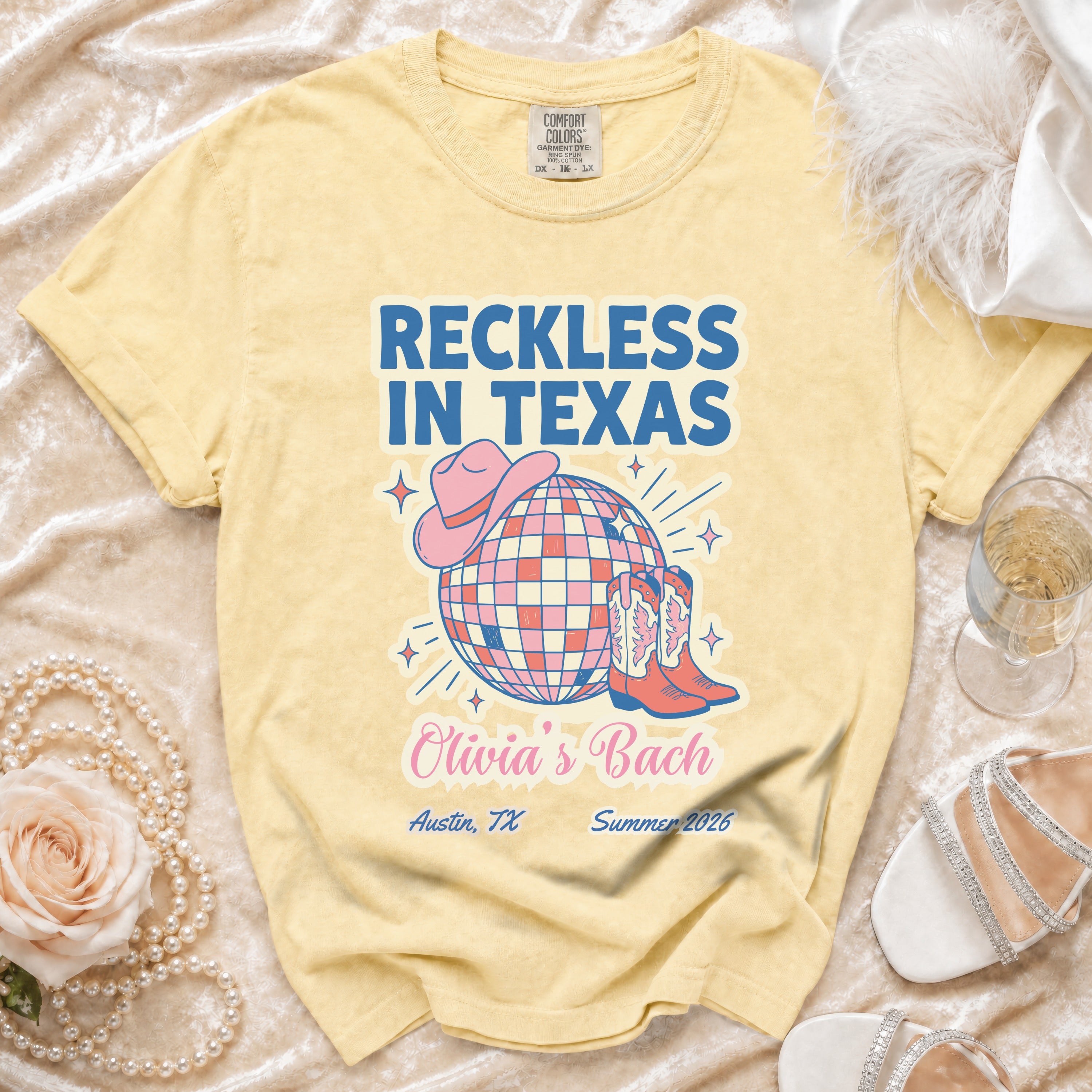 Yellow t-shirt with "Reckless in Texas" and "Olivia's Bach Austin, TX Summer 2026" text.