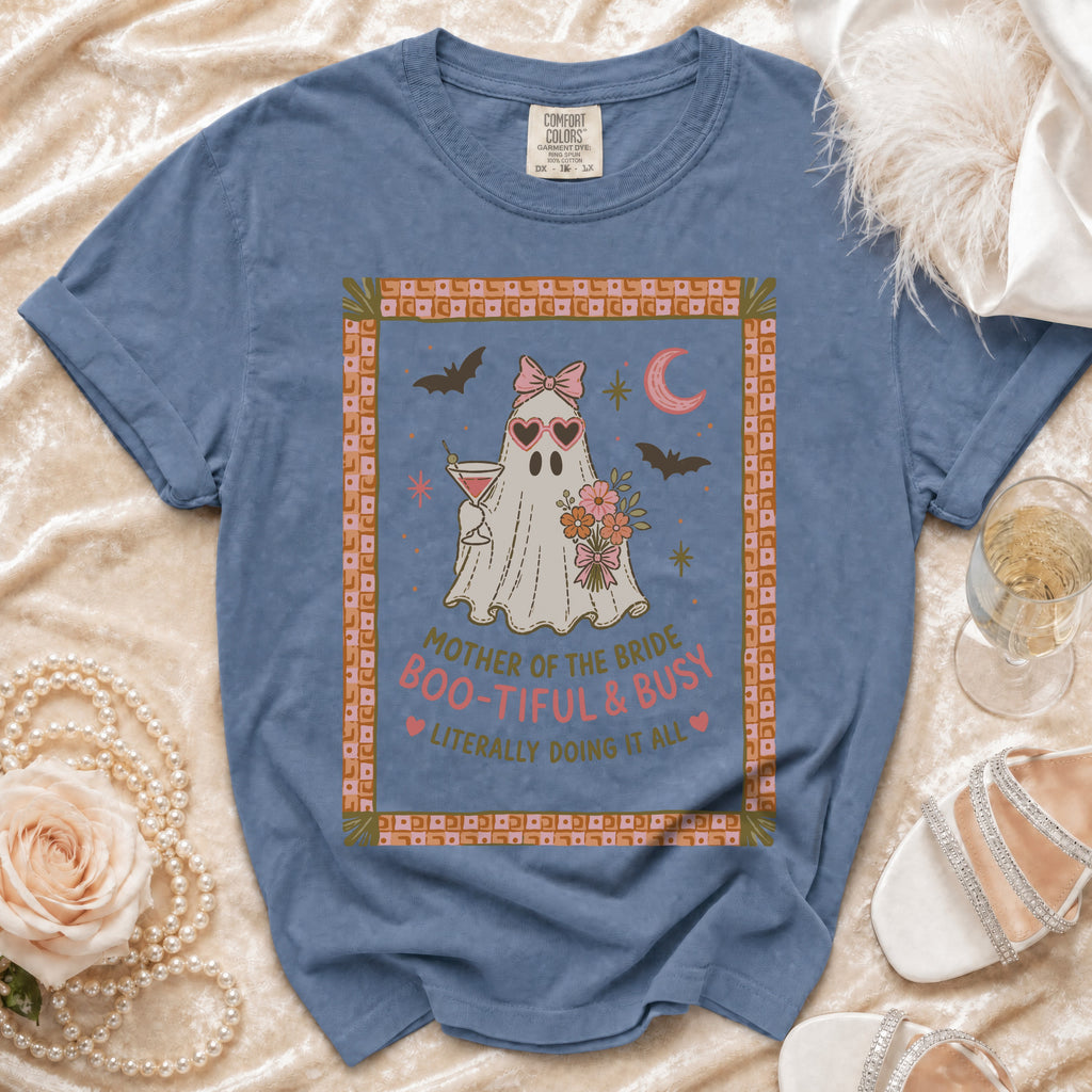 Blue Comfort Colors shirt with "Mother of the Bride Boo-Tiful & Busy" ghost graphic.