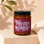 Candle with label "Two Mrs., no mister" and "vowed" below.