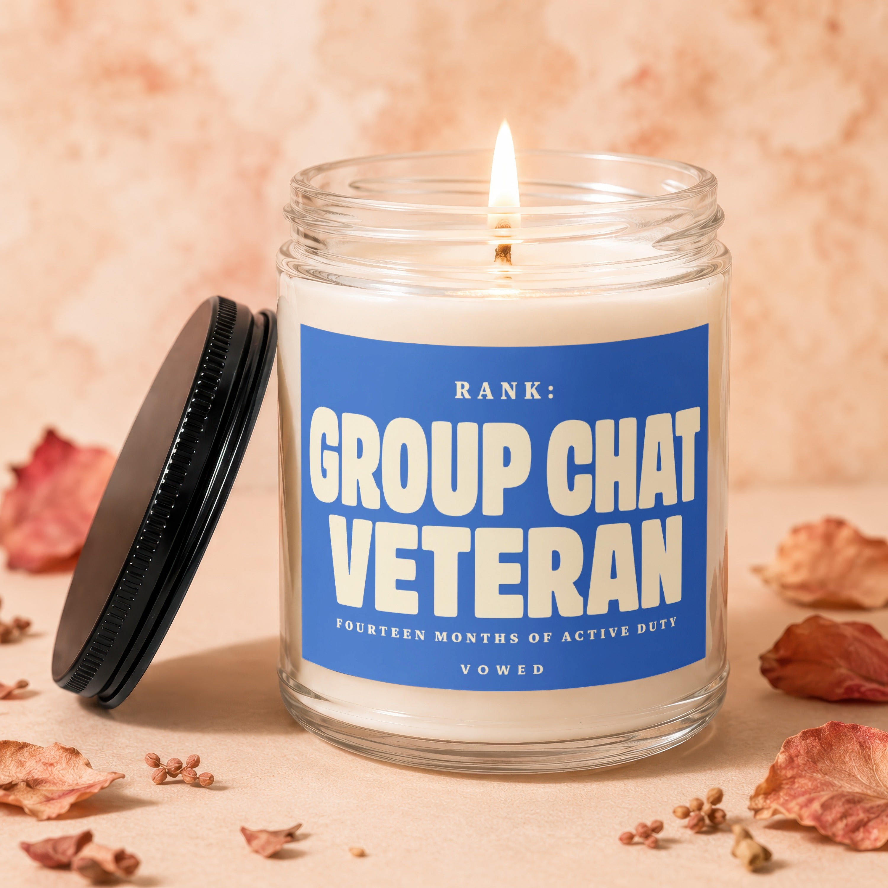 Candle with label "Group Chat Veteran, Fourteen Months of Active Duty, Vowed".