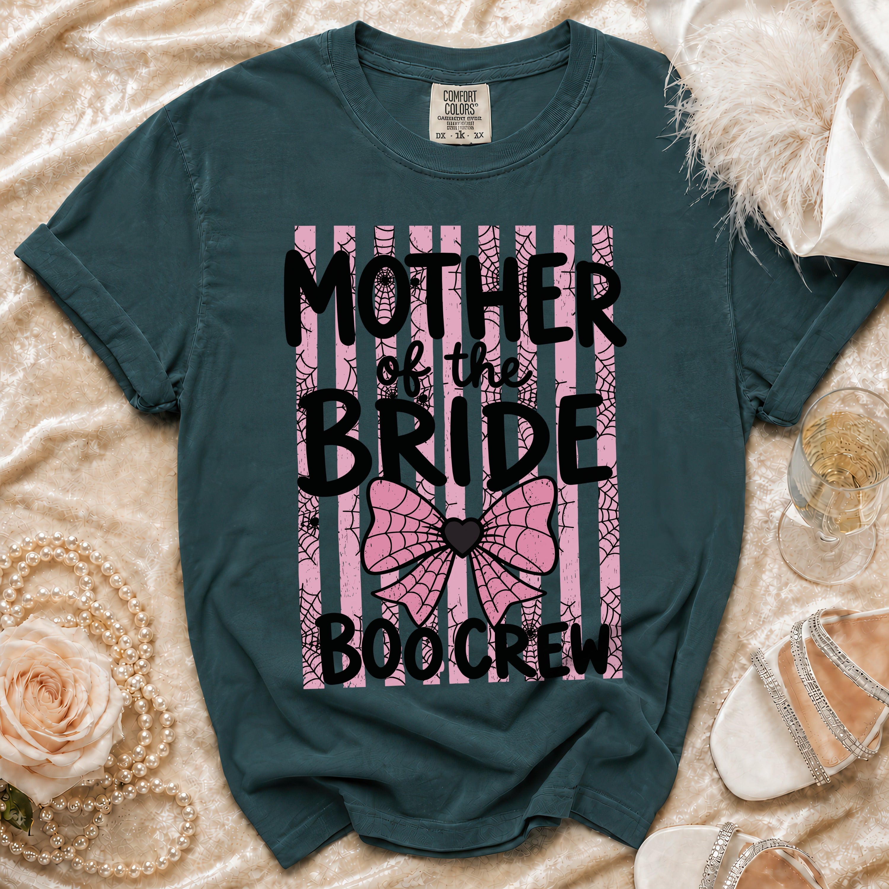 Teal t-shirt with "Mother of the Bride Boo Crew" text and spiderwebs.