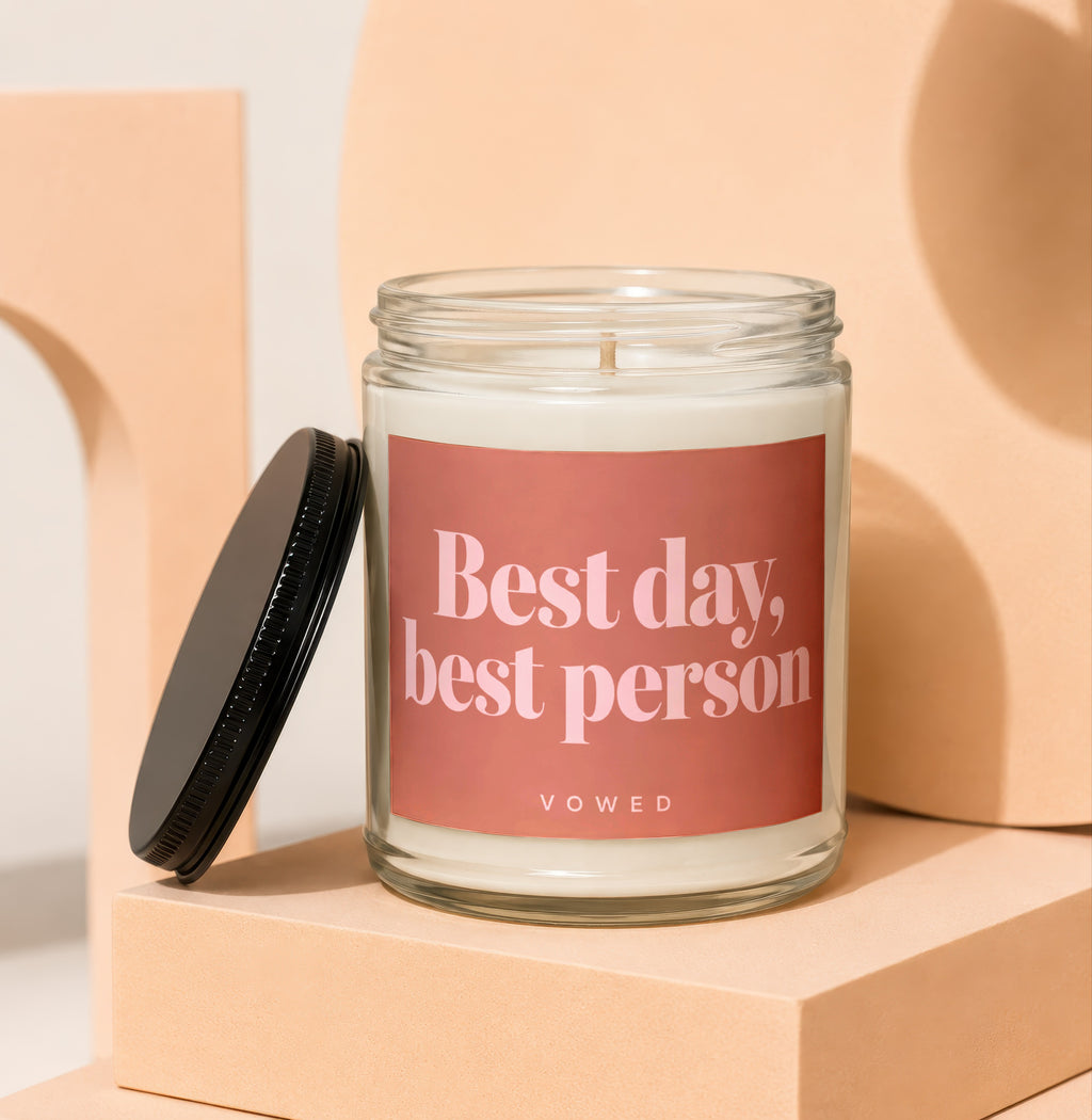 Glass jar candle with a pink label that reads "Best day, best person VOWED".