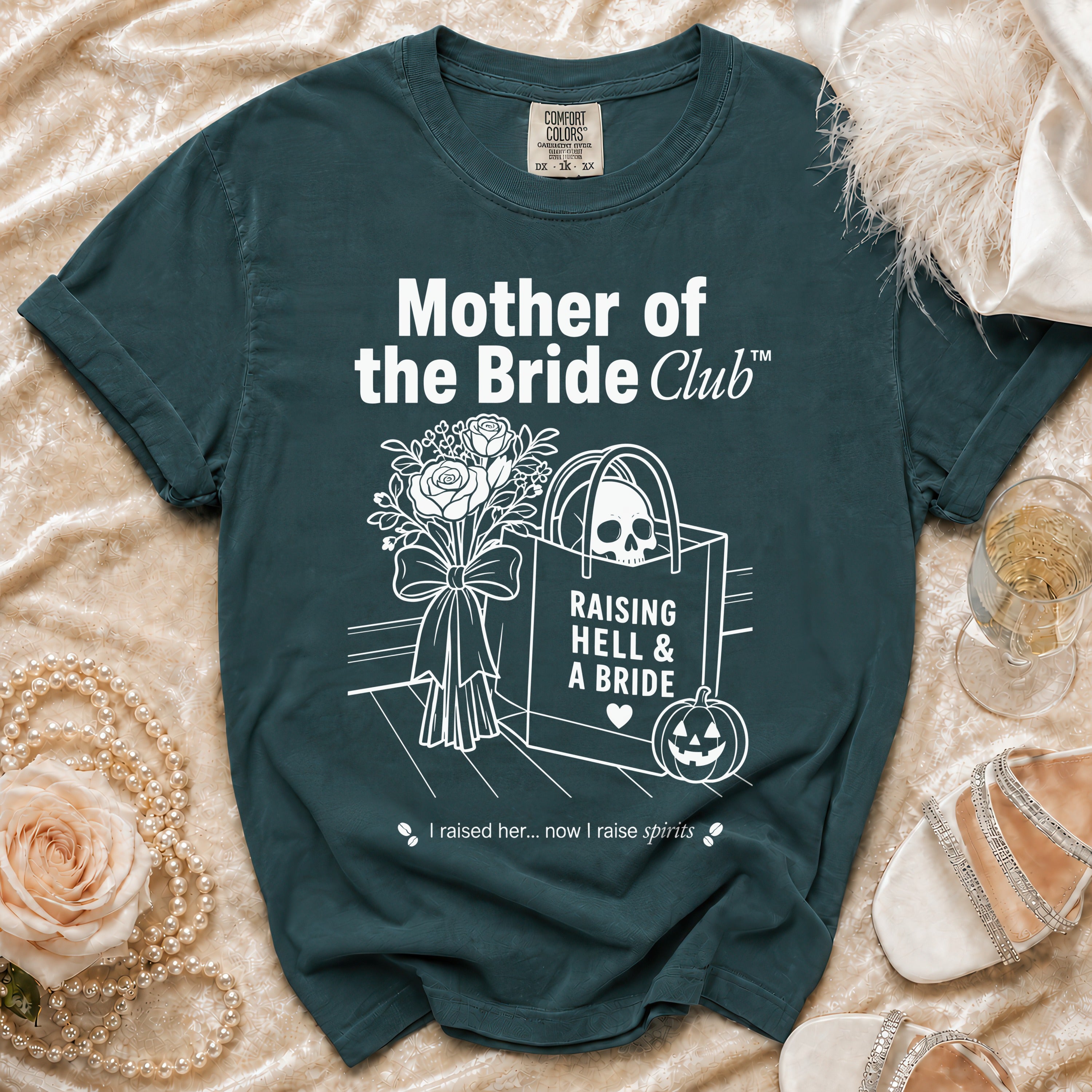 Dark green shirt with "Mother of the Bride Club" text and skull graphics.