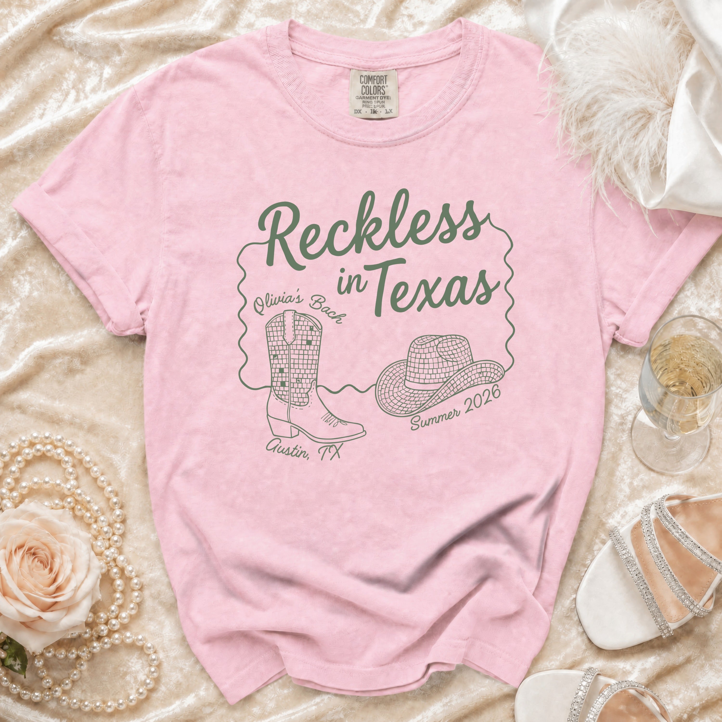 Pink t-shirt with "Reckless in Texas" design for Olivia's Bach in Austin, TX.