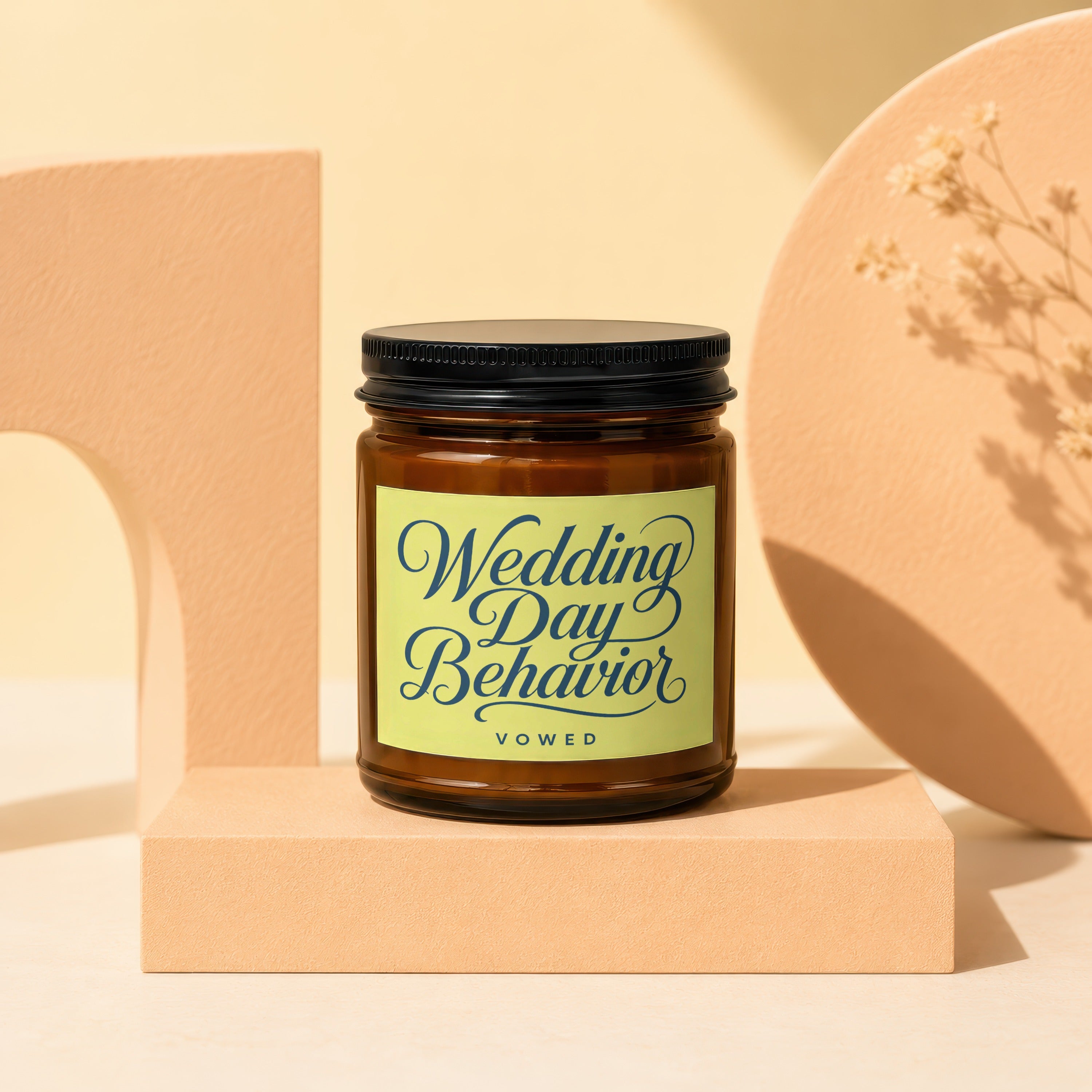 Amber glass candle with "Wedding Day Behavior VOWED" text on a light green label.