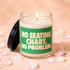 Lit candle in glass jar with "NO SEATING CHART. NO PROBLEM." text.