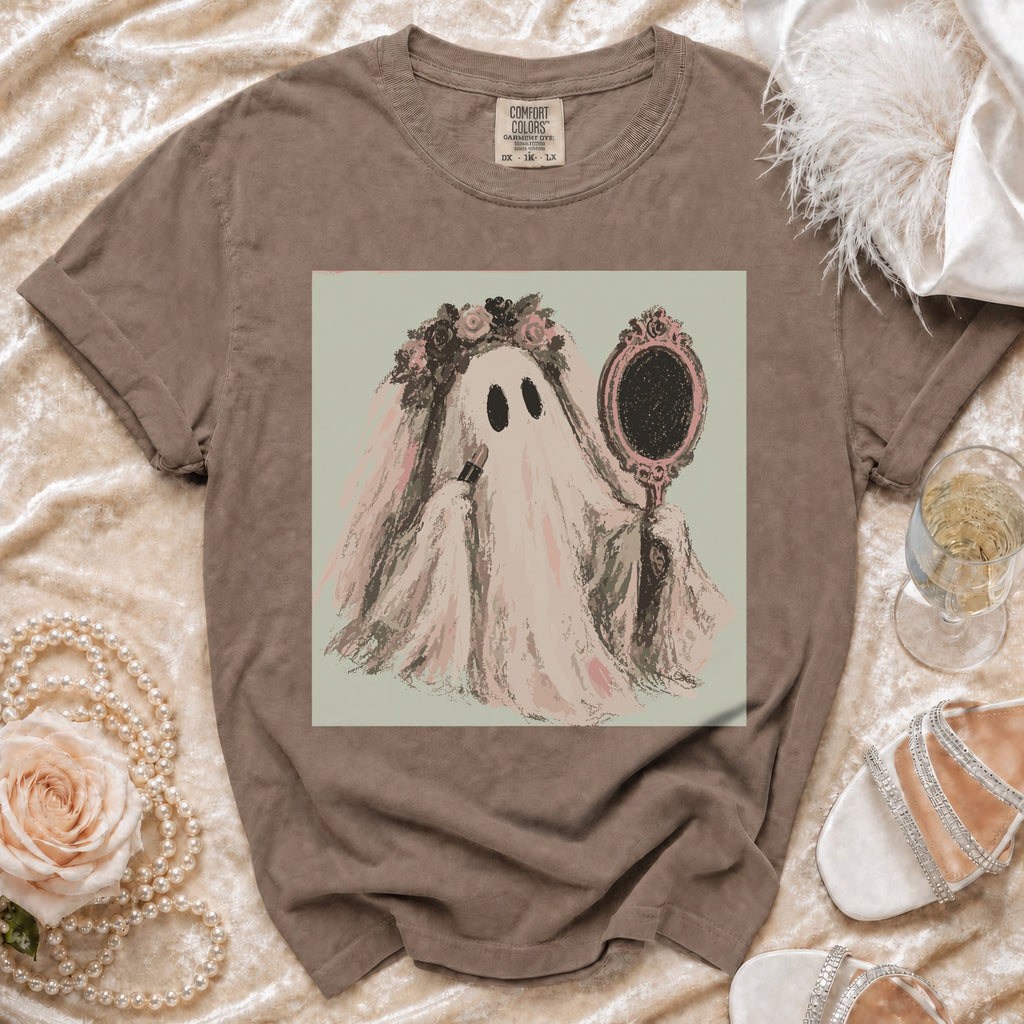 Ghost bride applying lipstick in ornate mirror, on brown Comfort Colors t-shirt.