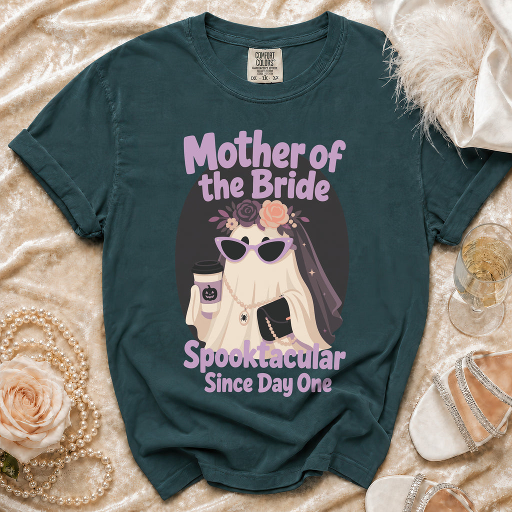 Dark teal t-shirt with a ghost graphic saying "Mother of the Bride Spooktacular Since Day One".