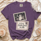 Purple t-shirt with graphic of wedding dress, skull, moon, and text.