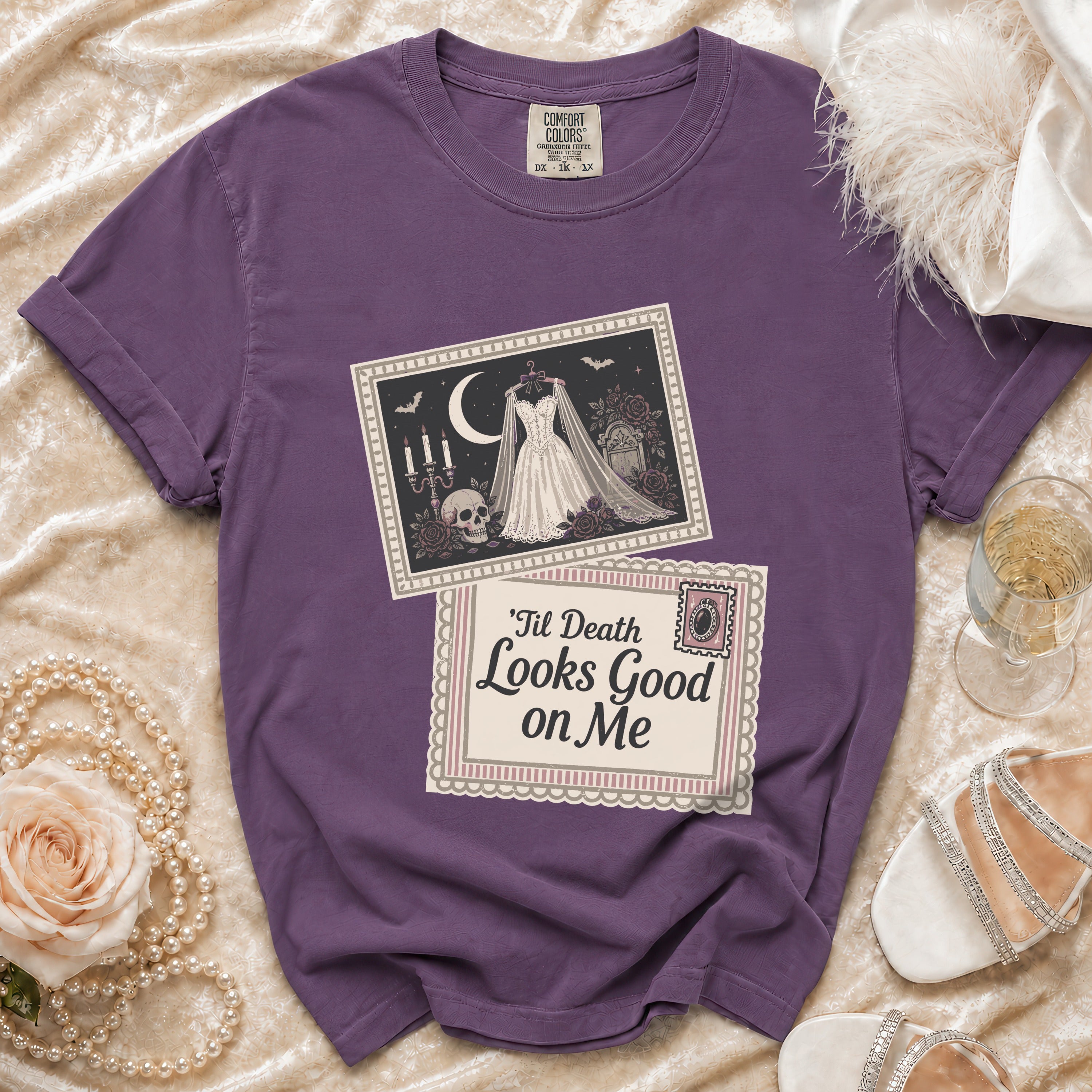 Purple t-shirt with graphic of wedding dress, skull, moon, and text.