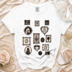 White t-shirt with Gothic-themed framed prints including skulls, roses, and cake.