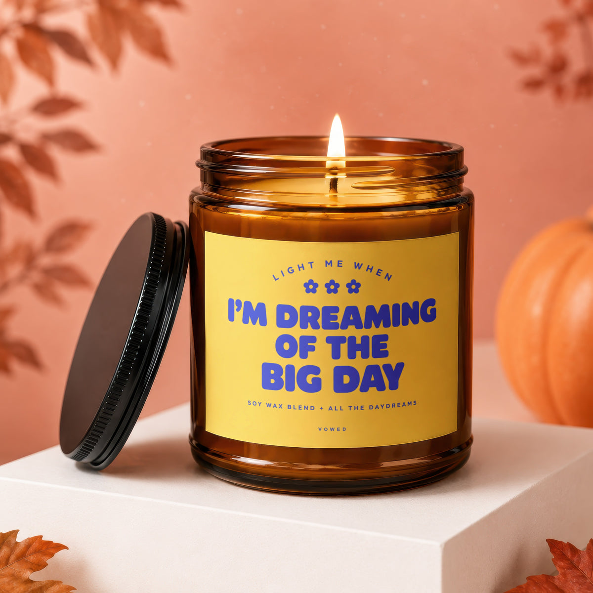 Amber glass candle with yellow label saying "I'M DREAMING OF THE BIG DAY".