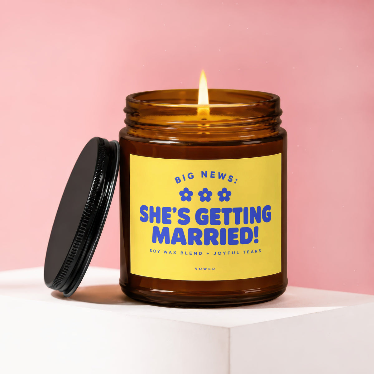 Amber jar candle with "She's Getting Married!" on yellow label.
